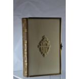 A compact Victorian gilt brass bound church services book containing the Book of Common Prayer etc.