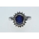 18ct white gold, sapphire & diamond cluster ring, size O, 5.57 grams
