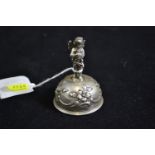 Continental silver table bell with cherub finial, with import marks, height 7cm, 63.92 grams