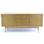 A teak mid-century sideboard by CWS. Comprised of 3 central drawers inc. cutlery drawer, flanked by