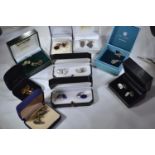 Nine pairs of silver cufflinks