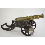 Large heavy brass cannon with metal wheels & carriage, L46cm H18cm