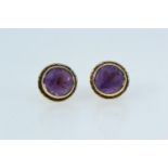 Pair of 9ct gold & amethyst ear studs, gross weight 2.67 grams, with non gold butterflies