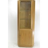 Ercol model 2138 elm & glass corner cabinet. H194cm W53cm