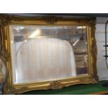 Bevelled mirror with ornate gilt frame 94cm x 68cm