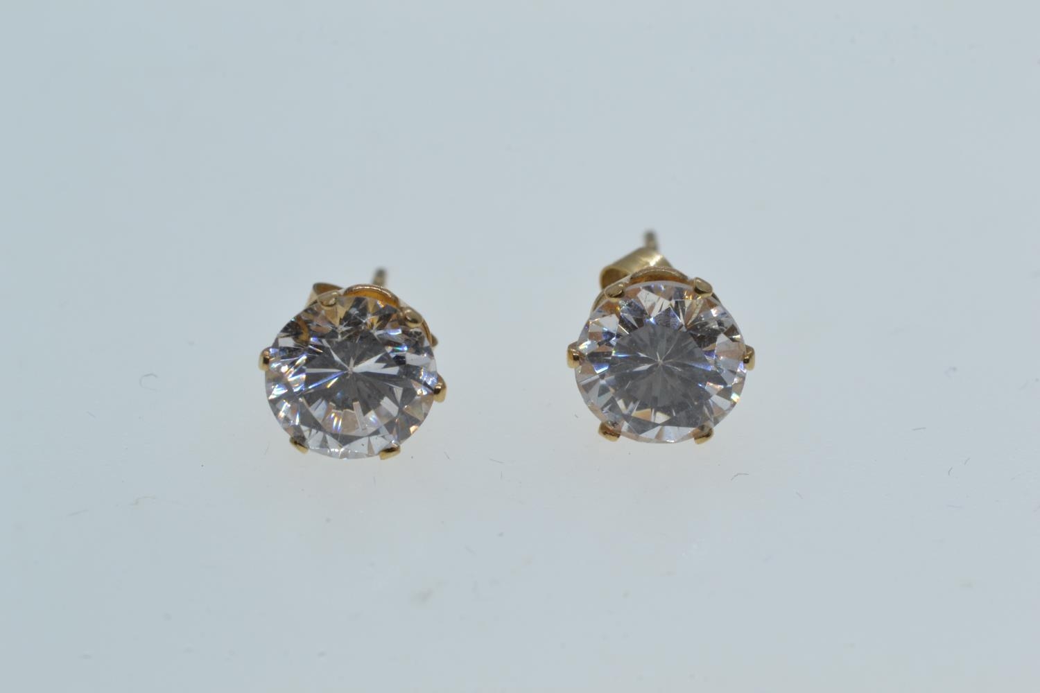 Pair of 9ct gold & white stone ear studs, gross weight 0.92 gram 