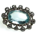 An impressive oval-cut aquamarine & diamond cluster brooch set in yellow & white metal, the aquamari