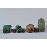 Four Egyptian beads, including two scarabs and other turquoise beads/sections