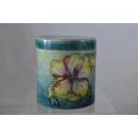 Moorcroft 'Hibiscus' pattern cylindrical pot & cover, impressed mark & paper label to underside of c