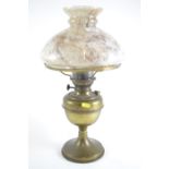 Paraffin lamp with brass base and marbled glass shade. Height 47cm