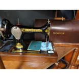 Singer sewing machine No.28 in case with accessories.