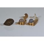 Two pairs of yellow metal earrings, one set with moonstone, tests positive for 9ct gold, gross weigh