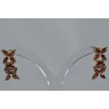 Pair of 9ct gold & red stone earrings, length 19mm, gross weight 2.67 grams