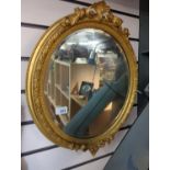 Oval gilt framed bevelled mirror 41cm x 53cm