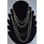 Eleven silver neck chains, various lengths, gross weight 70.6 grams