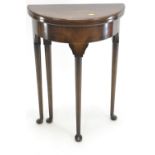 Folding mahogany demilune leather topped occasional table. W54cm h74cm