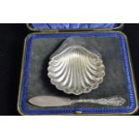 Cased silver scallop-shaped butter dish & knife, maker JR, Sheffield & Birmingham 1904 & 1898 respec