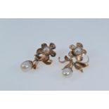 Pair of 9ct gold & cultured pearl pendant earrings, length 38mm, gross weight 6.57 grams, one butter