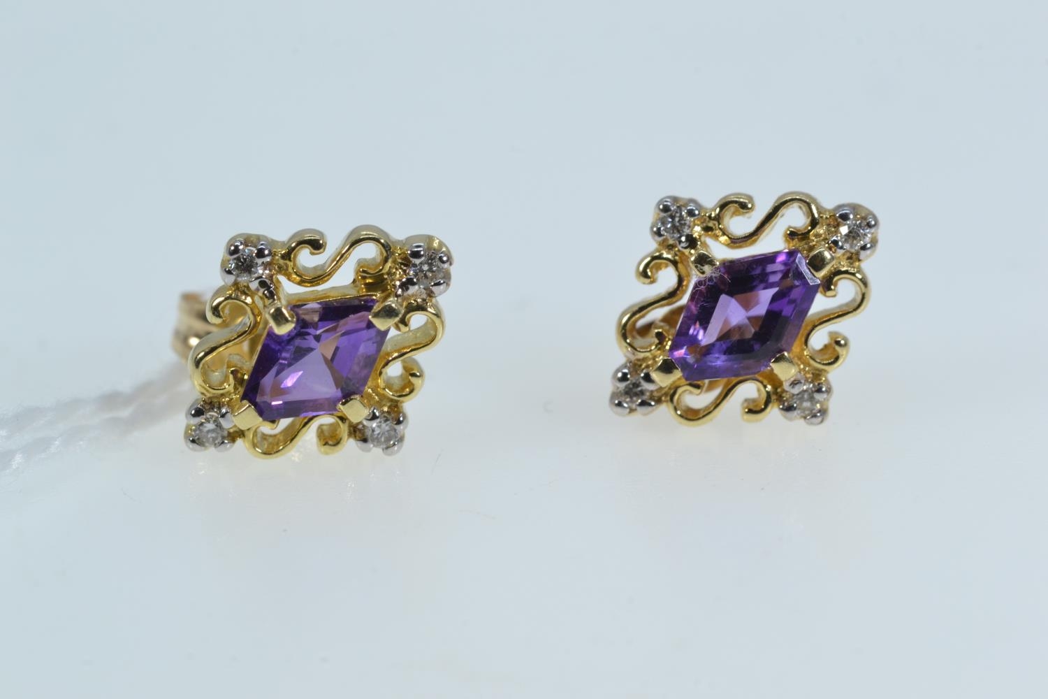 Pair of 14ct gold, amethyst & diamond earrings, one butterfly 9ct gold, gross weight 1.85 grams 