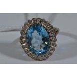 9ct gold, 6.64 carat blue topaz & diamond ring, size L, 4.95 grams