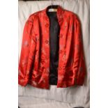 Oriental silk jacket in red (lined) together with an Oriental style crewel work jacket