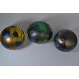 Three John Ditchfield Glasform iridescent glass paperweights, including two spherical & one ovoid, e