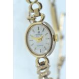 Marvin Revue 9ct gold cased ladies quartz wristwatch, with 9ct gold St. Christopher charm attached t