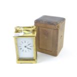 Brass carriage clock, twelve with travelling case. (2 keys present)