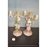 Pair of James Bevington porcelain figural candelabra, late 19th century, one with crossed sword JB m