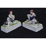 Pair of Staffordshire groups of a child & dog, probably depicting the royal children, each modelled