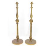 Pair of carved gilt torcheres. Missing candle supports. H130cm
