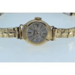 Majex 9ct gold cased watch, 21 jewels, case diameter 15mm, with a rolled gold strap