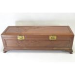 Long oriental camphor wood chest with bamboo relief W138 x D43 x H43, includes internal tray