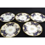 Five Coalport dessert plates, late 19th/early 20th century, retailed by T. Goode & Co., printed and