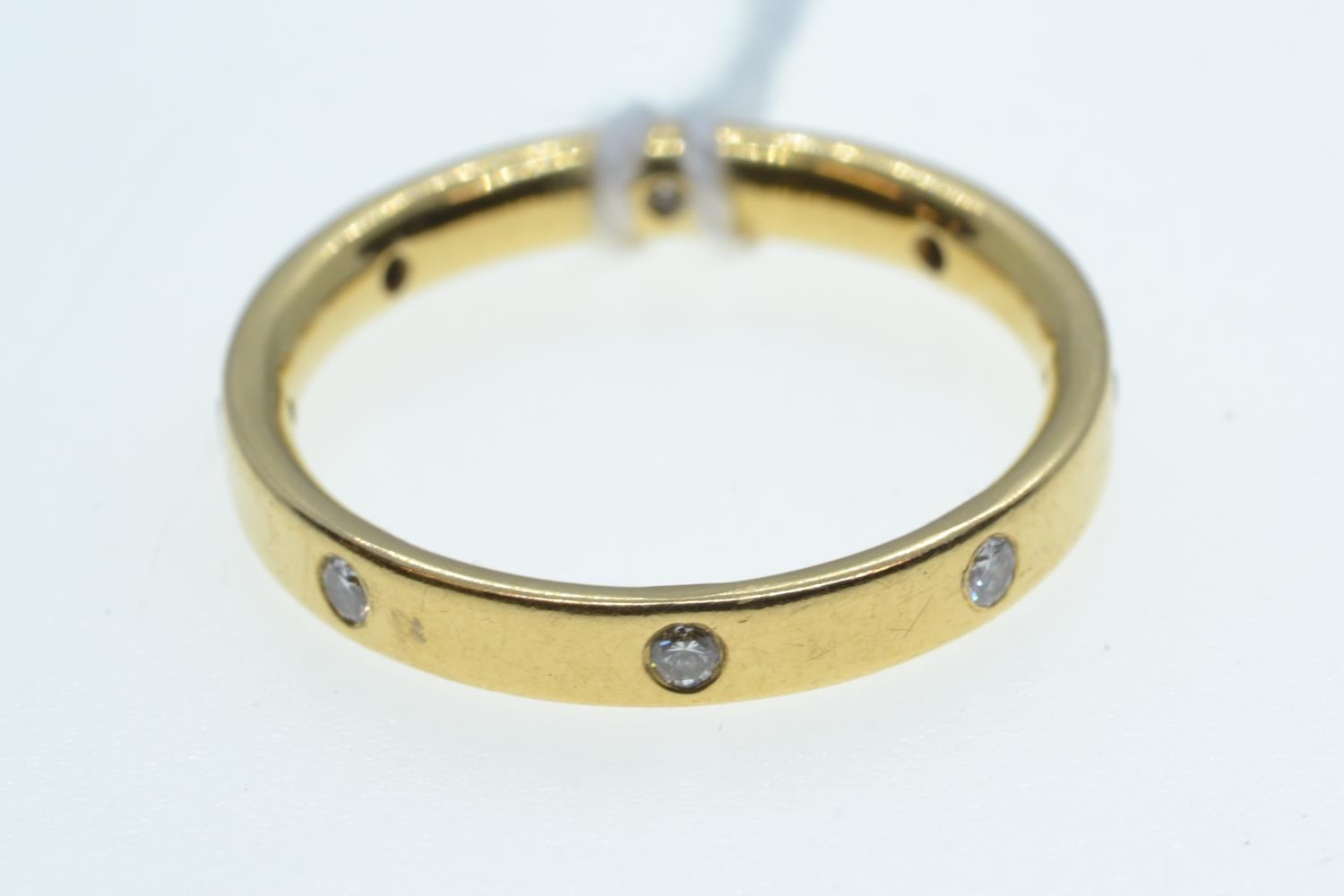 Yellow metal & diamond band ring, tests positive for 22ct gold, size O, 3.8 grams 