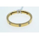 Yellow metal & diamond band ring, tests positive for 22ct gold, size O, 3.8 grams