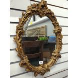 Gilt plaster framed oval mirror 65 x 48cm