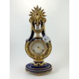 Victoria & Albert Museum reproduction 'Marie-Antoinette' lyre clock, with cobalt blue porcelain case
