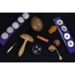 Collection of Victorian carved mother-of-pearl buttons (30mm diameter), wooden walnut thimble case,