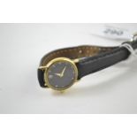Raymond Weil gold plated ladies watch, jewelled & black dial with date aperture, case back numbered