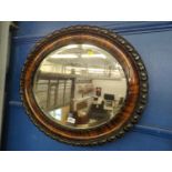 Oval bevelled mirror in mahogany veneered frame 65 x 54cm