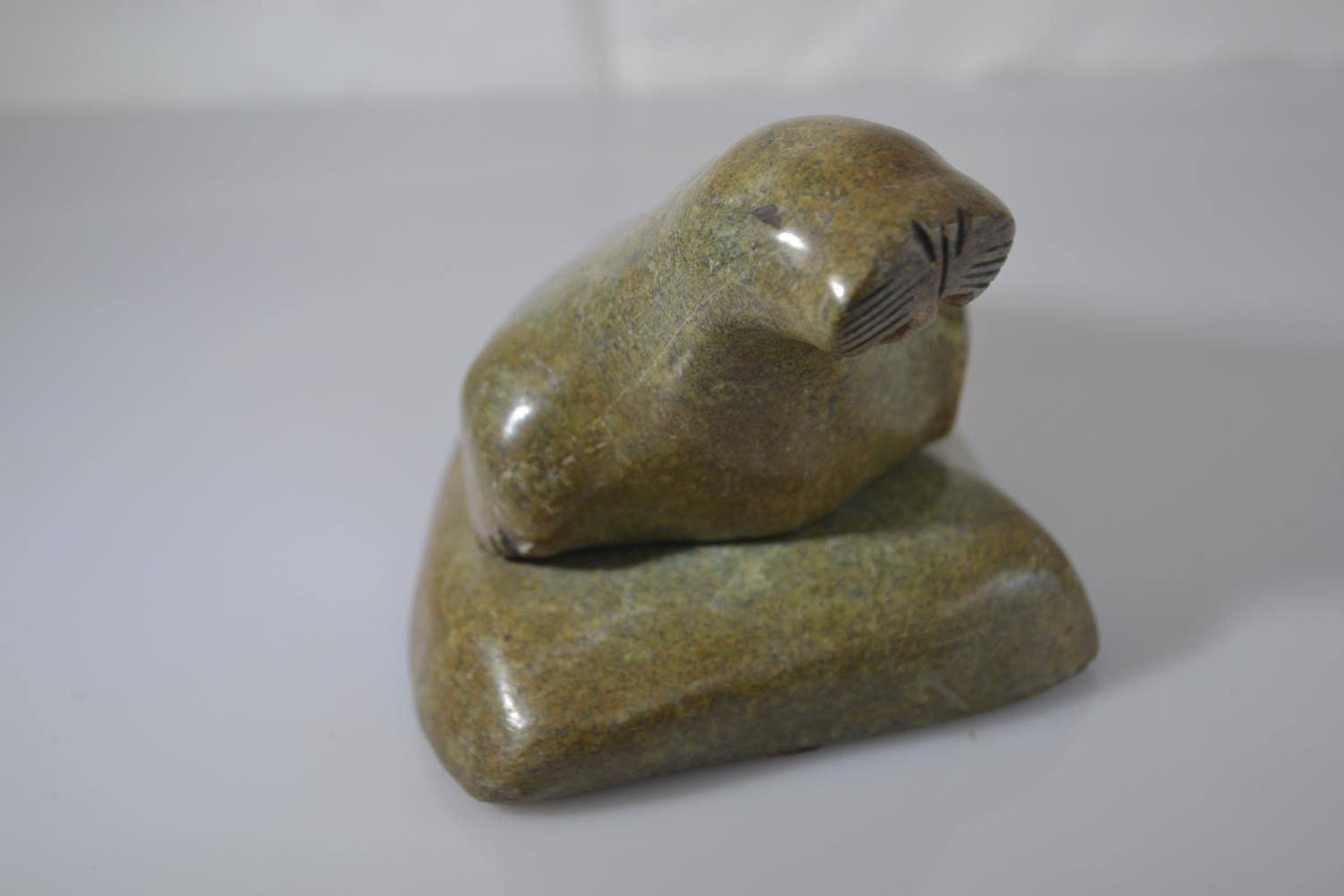 Canadian Eskimo Art green stone Inuit carving of a walrus on a rock, length 13.5cm x height 8.5cm  - Image 2 of 4