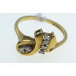 18ct gold & diamond ring, the central scrolling motif set with five diamonds, size M, 3.44 grams