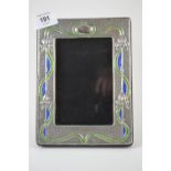 Art Nouveau style, silver & enamel photo frame, stamped 'Sterling', overall 14.5x19.5cm