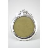 Circular silver photo frame, maker EM & S, Birmingham, with an open work ribbon surmount, height 15.