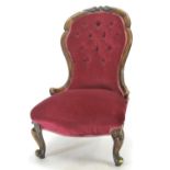 Late Victorian mahogany framed button back nursing chair. Frame loose to rear.