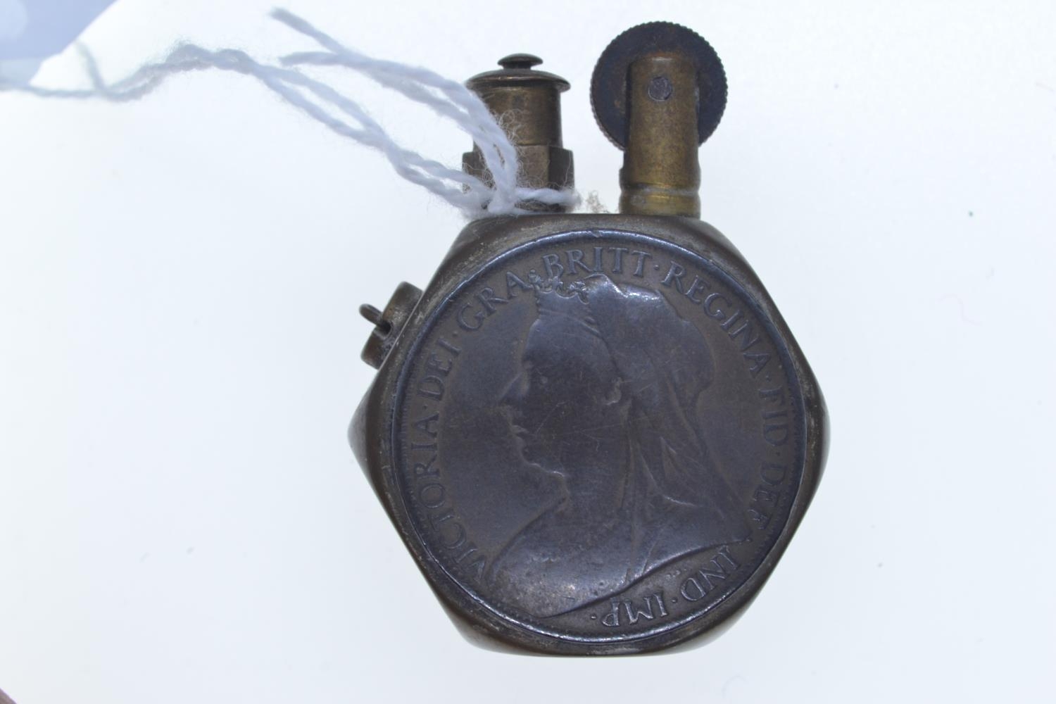WWI Queen Victoria penny brass trench lighter, approx. 35 x 50mm overall  - Image 2 of 2