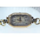 9ct gold cased watch, with a rolled gold bracelet strap