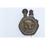 WWI Queen Victoria penny brass trench lighter, approx. 35 x 50mm overall