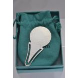 Tiffany & Co. Silver golf ball bookmark, together with a Tiffany & Co. pouch & card box